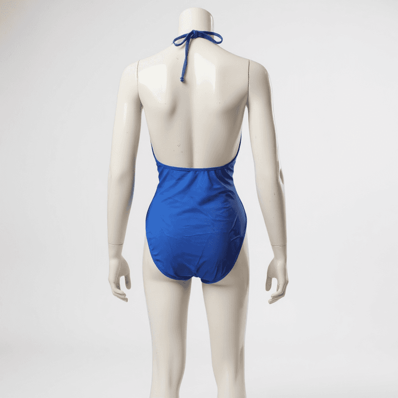 Elegante bañador de una pieza en un vibrante tono azul, con un escote halter y una espalda abiert...
